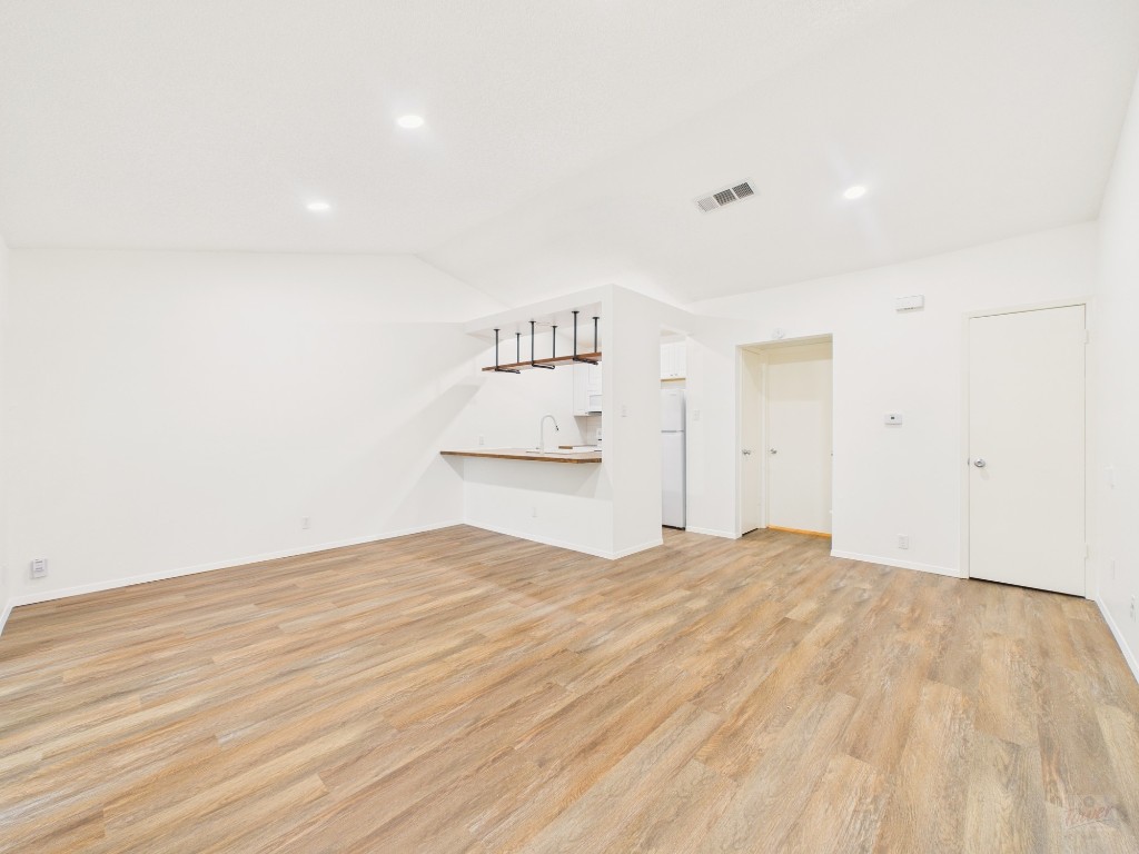 1305 Hollow Creek Drive, Unit 4 Austin, TX 78704 - Photo 1 of 21 a view of empty room with wooden floor