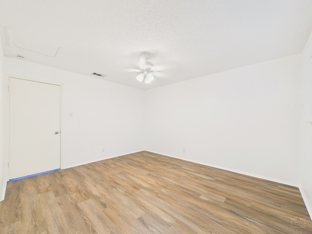1305 Hollow Creek Drive, Unit 4 Austin, TX 78704 - Photo 11 of 21 a view of a big room with wooden floor