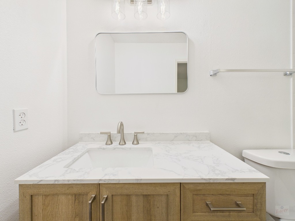 1305 Hollow Creek Drive, Unit 4 Austin, TX 78704 - Photo 14 of 21 a bathroom with a sink and a mirror