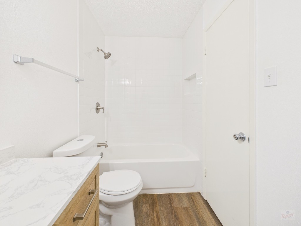 1305 Hollow Creek Drive, Unit 4 Austin, TX 78704 - Photo 15 of 21 a bathroom with a sink a toilet and shower