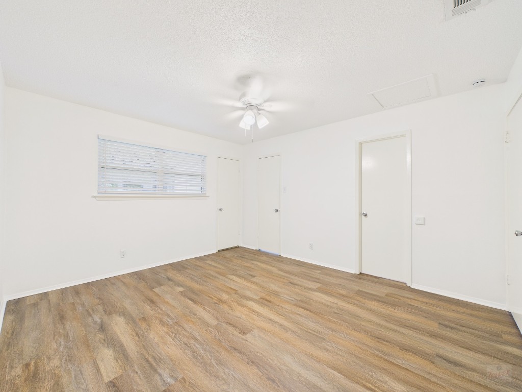 1305 Hollow Creek Drive, Unit 4 Austin, TX 78704 - Photo 9 of 21 wooden floor in an empty room