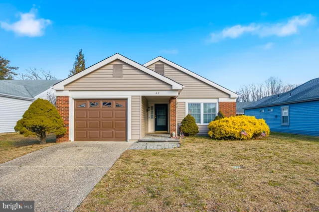 a front view of a house with a garage