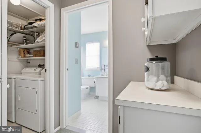 a kitchen with a refrigerator and cabinets