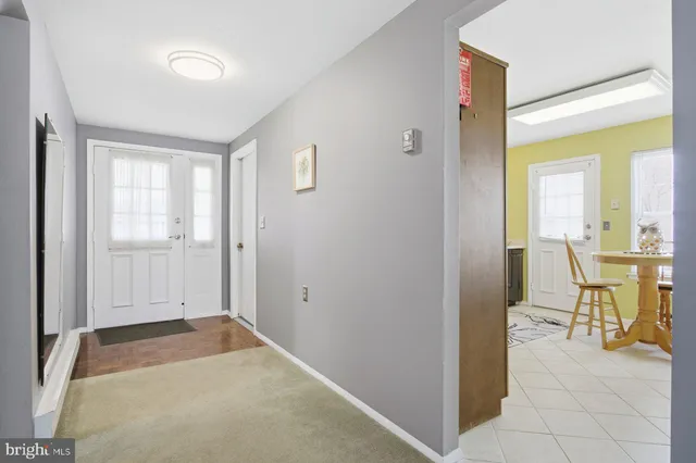 a view of a room with furniture and a window
