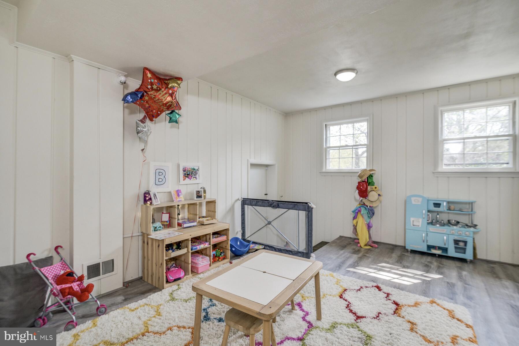 5512 Christy Drive Bethesda, MD 20816 - Photo 29 of 40 Mid level downstairs playroowith daylight windows.