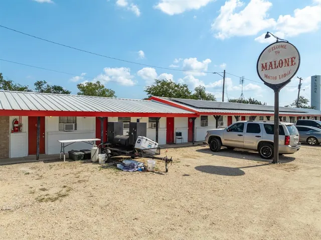 a view of car parked in front of house