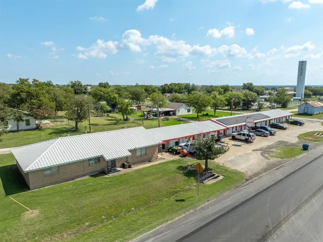 an aerial view of a garden with an outdoor seating