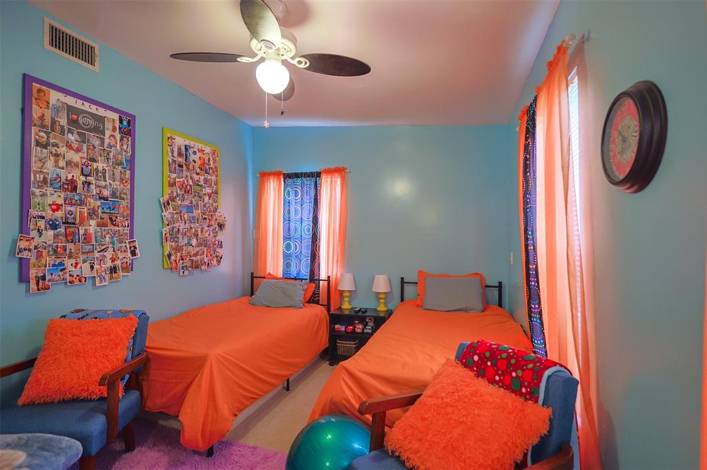309 Tejas Trail Springtown, TX 76082 - Photo 23 of 40 a bedroom with two beds and a large window