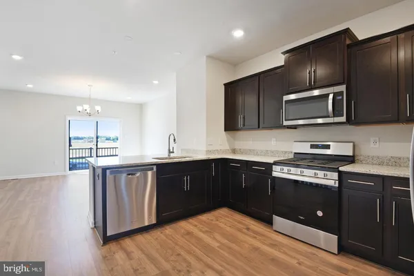 a view of a kitchen and a sink