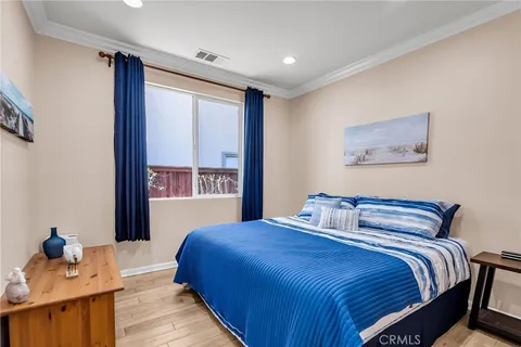 a bedroom with a large bed and a window