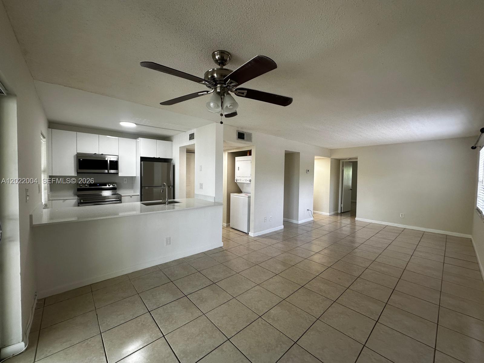 3400 Foxcroft Road, Unit 301 Miramar, FL 33025 - Photo 13 of 72 a view of a kitchen with microwave and cabinets