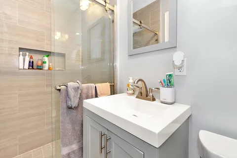 a bathroom with a sink and a mirror