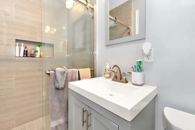 a bathroom with a sink and a mirror
