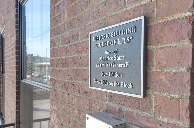a sign on the wall of building