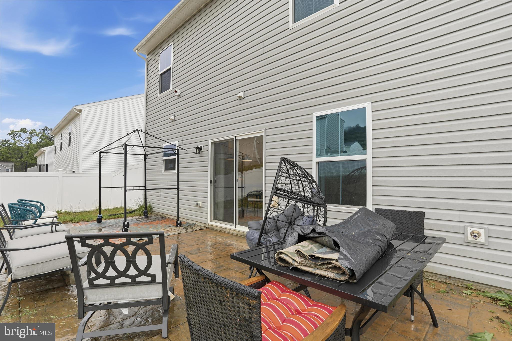 76 Diving Scaup Road Hedgesville, WV 25427 - Photo 30 of 48 a view of a patio with two chairs and a table