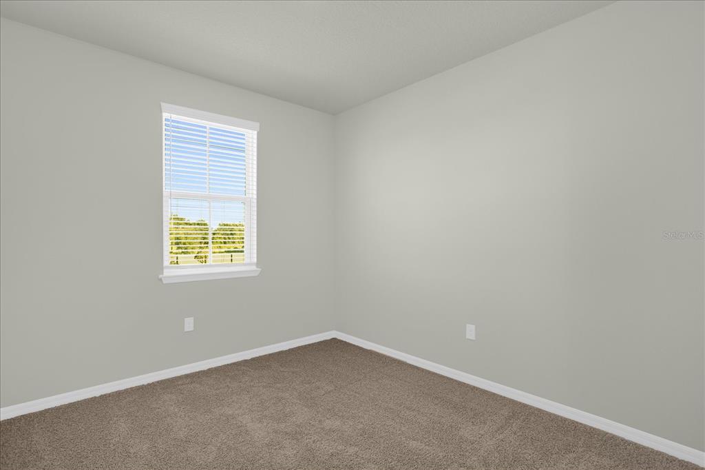 4438 Small Creek Road Kissimmee, FL 34744 - Photo 19 of 21 an empty room with a window