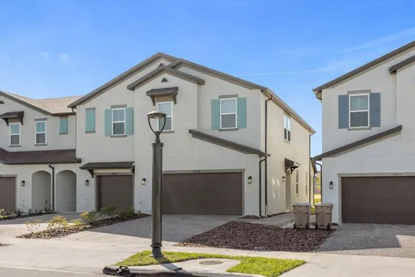 a front view of a house with parking space
