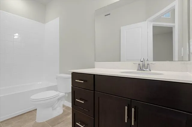 a bathroom with a sink toilet a mirror and shower