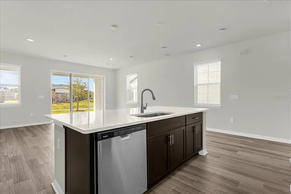 a kitchen with sink and window