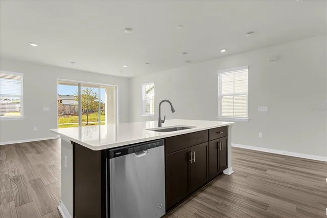 a kitchen with sink and window