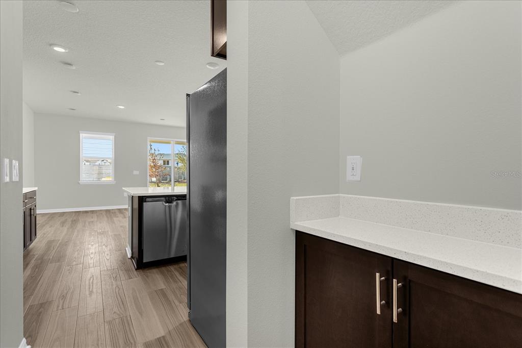 4438 Small Creek Road Kissimmee, FL 34744 - Photo 9 of 21 a view of kitchen with windows and refrigerator
