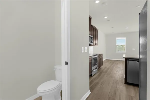 a view of a kitchen from the hallway