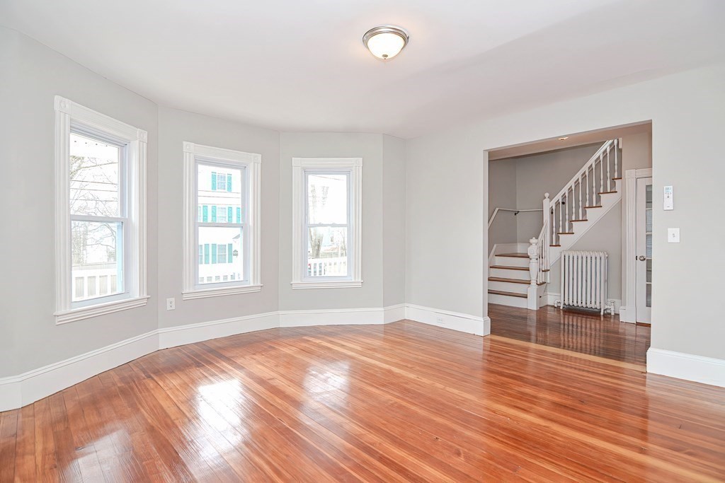 14 Allen Road Norwood, MA 02062 - Photo 11 of 36 an empty room with wooden floor and windows