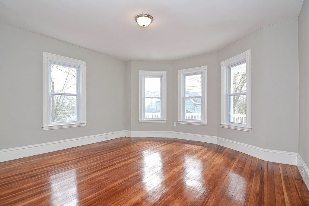 14 Allen Road Norwood, MA 02062 - Photo 12 of 36 a view of an empty room with wooden floor and a window