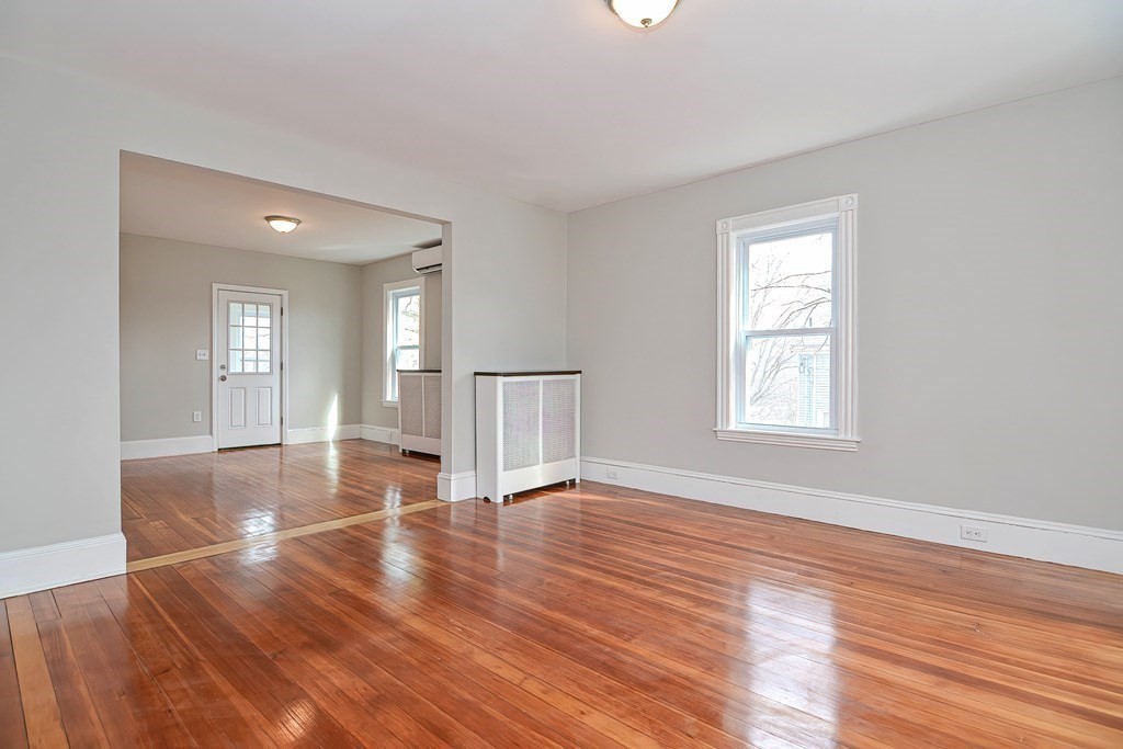14 Allen Road Norwood, MA 02062 - Photo 13 of 36 an empty room with wooden floor and windows