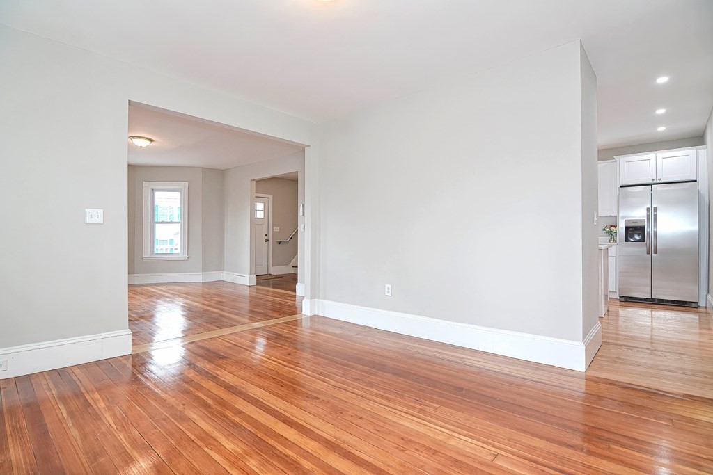 14 Allen Road Norwood, MA 02062 - Photo 14 of 36 a view of a big room with wooden floor and a bathroom