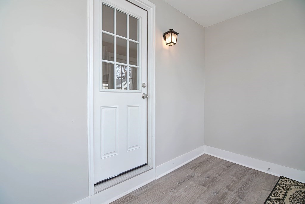 14 Allen Road Norwood, MA 02062 - Photo 18 of 36 a view of an empty room with wooden floor and windows