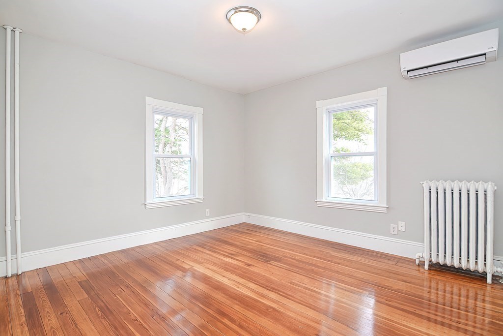 14 Allen Road Norwood, MA 02062 - Photo 19 of 36 an empty room with wooden floor and windows