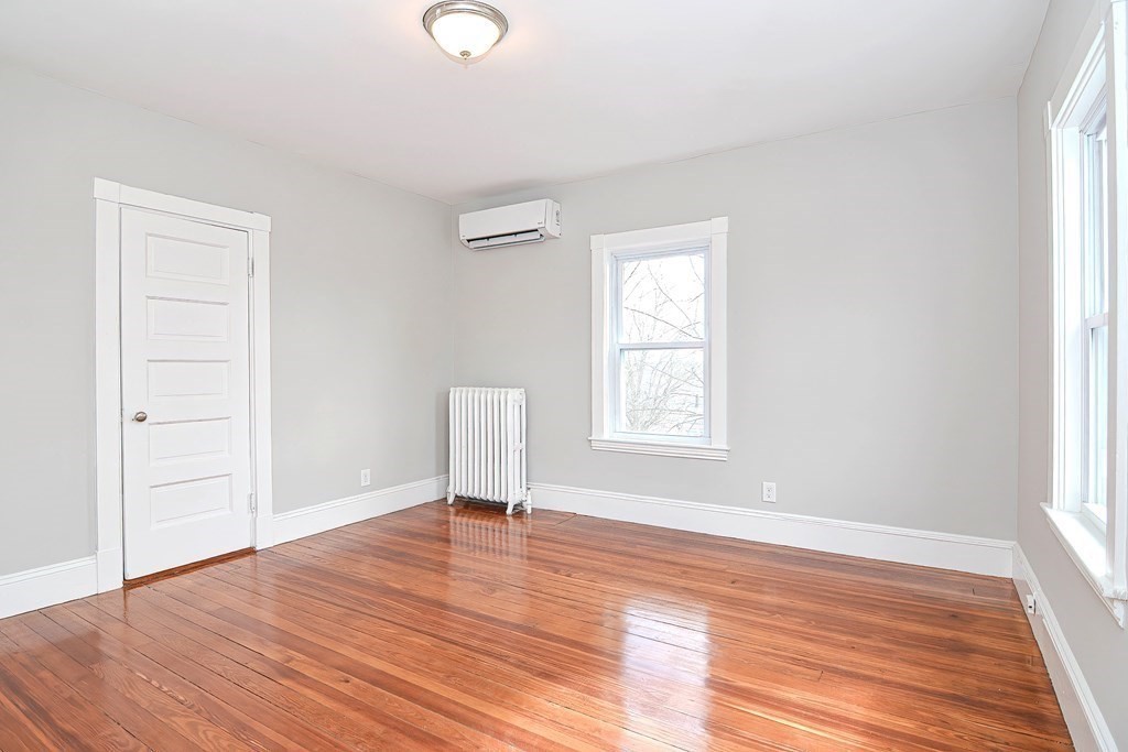 14 Allen Road Norwood, MA 02062 - Photo 20 of 36 an empty room with wooden floor and windows