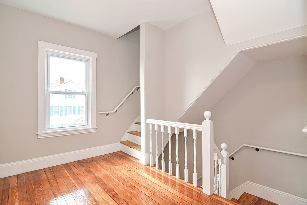 14 Allen Road Norwood, MA 02062 - Photo 27 of 36 a view of an empty room with wooden floor and a window