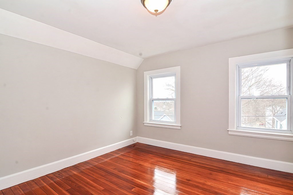 14 Allen Road Norwood, MA 02062 - Photo 31 of 36 an empty room with wooden floor and windows