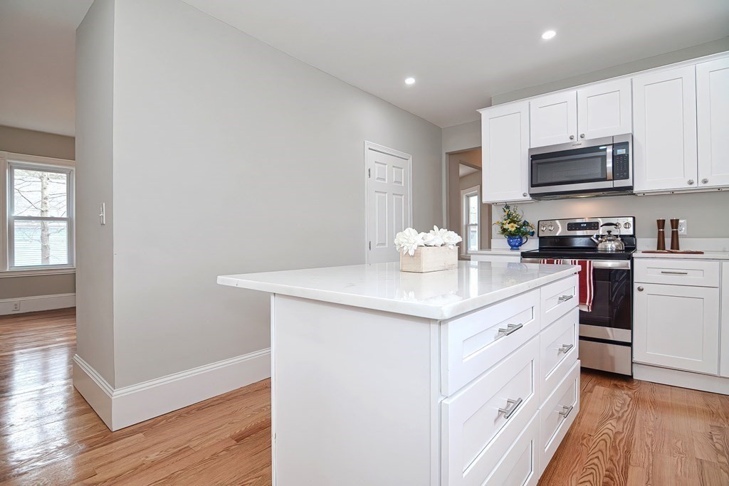 14 Allen Road Norwood, MA 02062 - Photo 6 of 36 a kitchen with stainless steel appliances kitchen island granite countertop a sink stove and cabinets