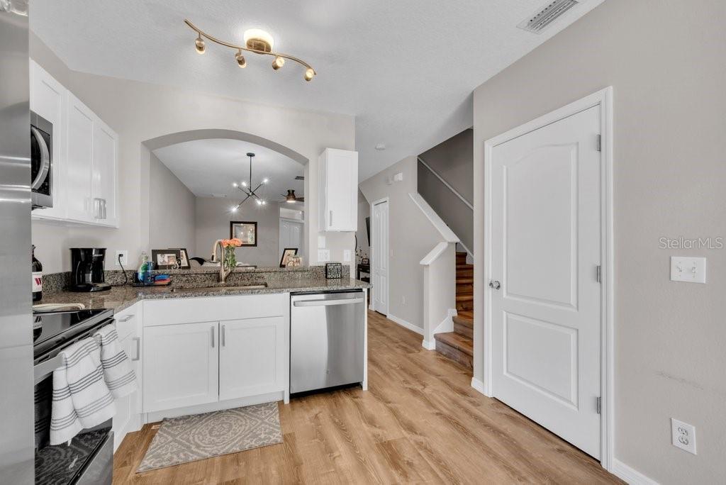 15855 Fishhawk View Drive Lithia, FL 33547 - Photo 11 of 31 a kitchen with a sink stainless steel appliances and cabinets