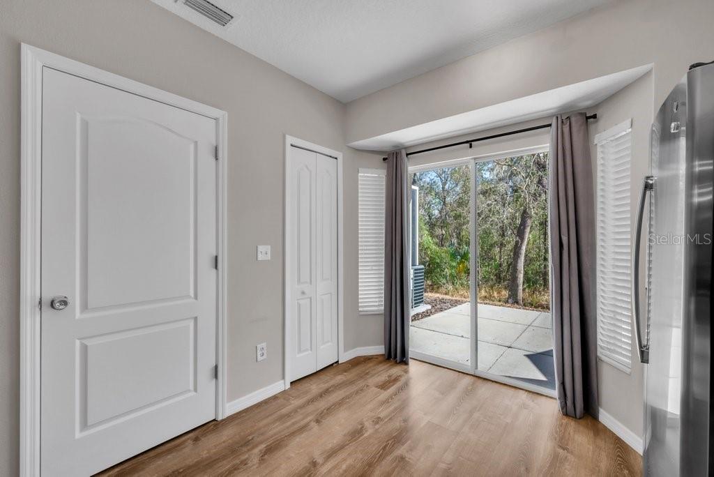 15855 Fishhawk View Drive Lithia, FL 33547 - Photo 12 of 31 a view of empty room with wooden floor and fan