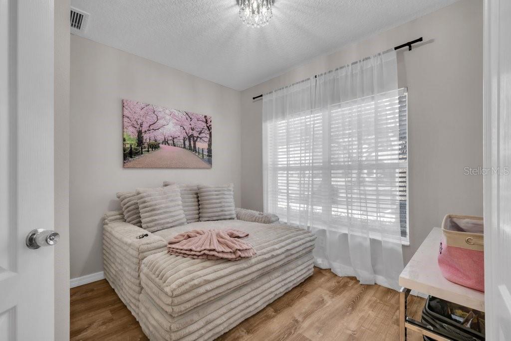 15855 Fishhawk View Drive Lithia, FL 33547 - Photo 14 of 31 a bedroom with a bed and a window