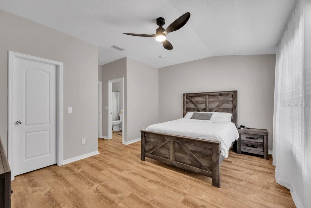 15855 Fishhawk View Drive Lithia, FL 33547 - Photo 18 of 31 a bedroom with a bed and a table