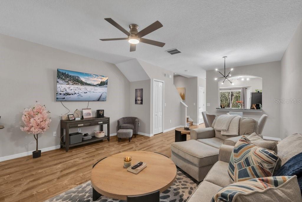 15855 Fishhawk View Drive Lithia, FL 33547 - Photo 5 of 31 a living room with furniture and a lamp