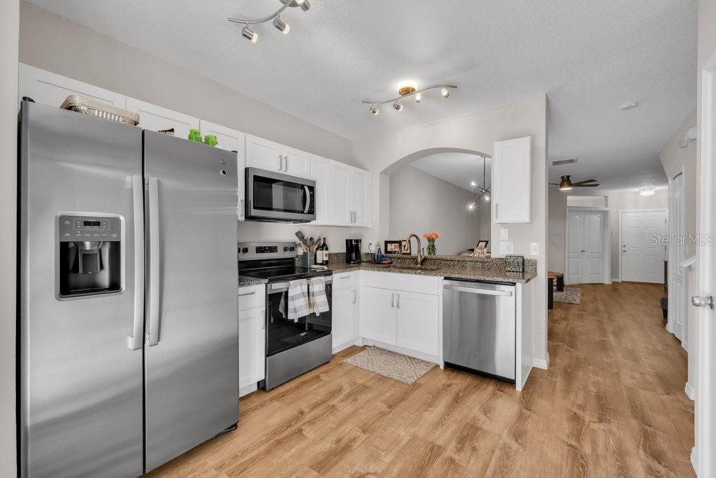 15855 Fishhawk View Drive Lithia, FL 33547 - Photo 10 of 31 a kitchen with a refrigerator and a sink