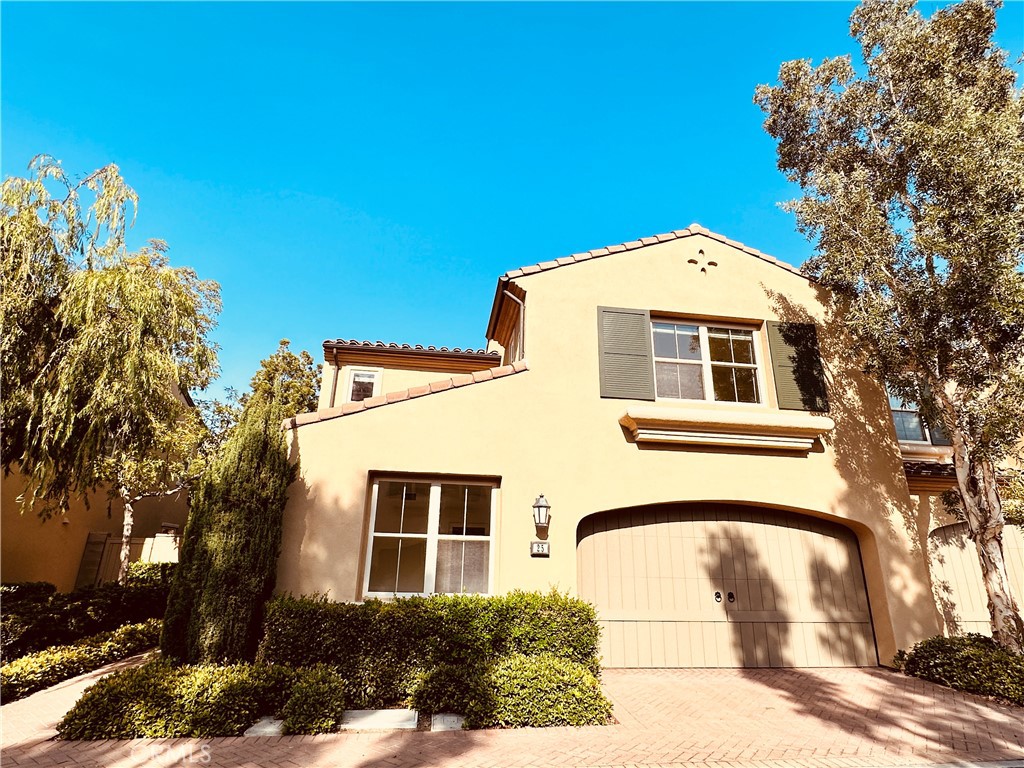 25 Deergrass Irvine, CA 92618 - Photo 1 of 1 a front view of a house with a garden