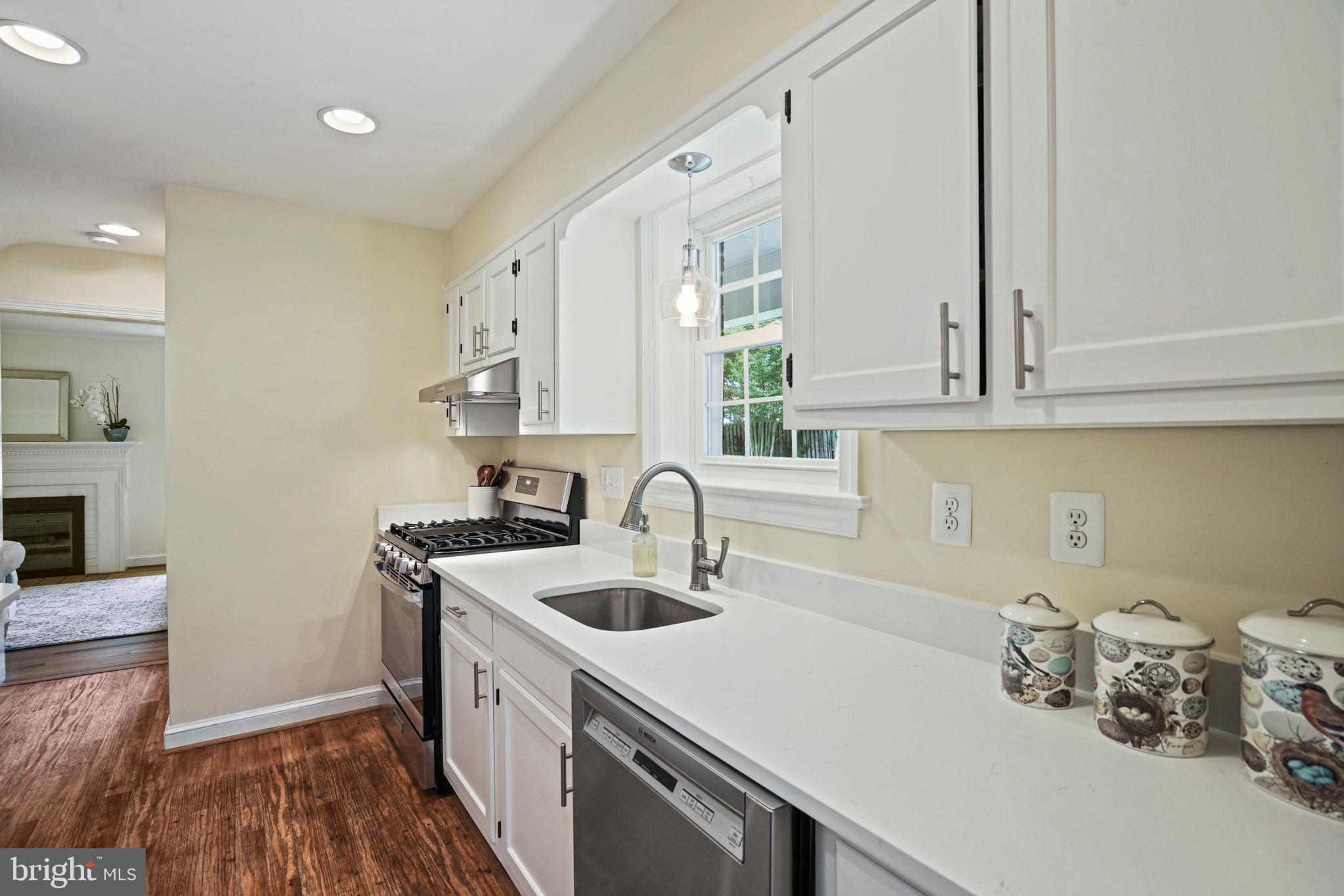 1907 Brisbane Street Silver Spring, MD 20902 - Photo 9 of 39 a kitchen with a sink a stove and cabinets