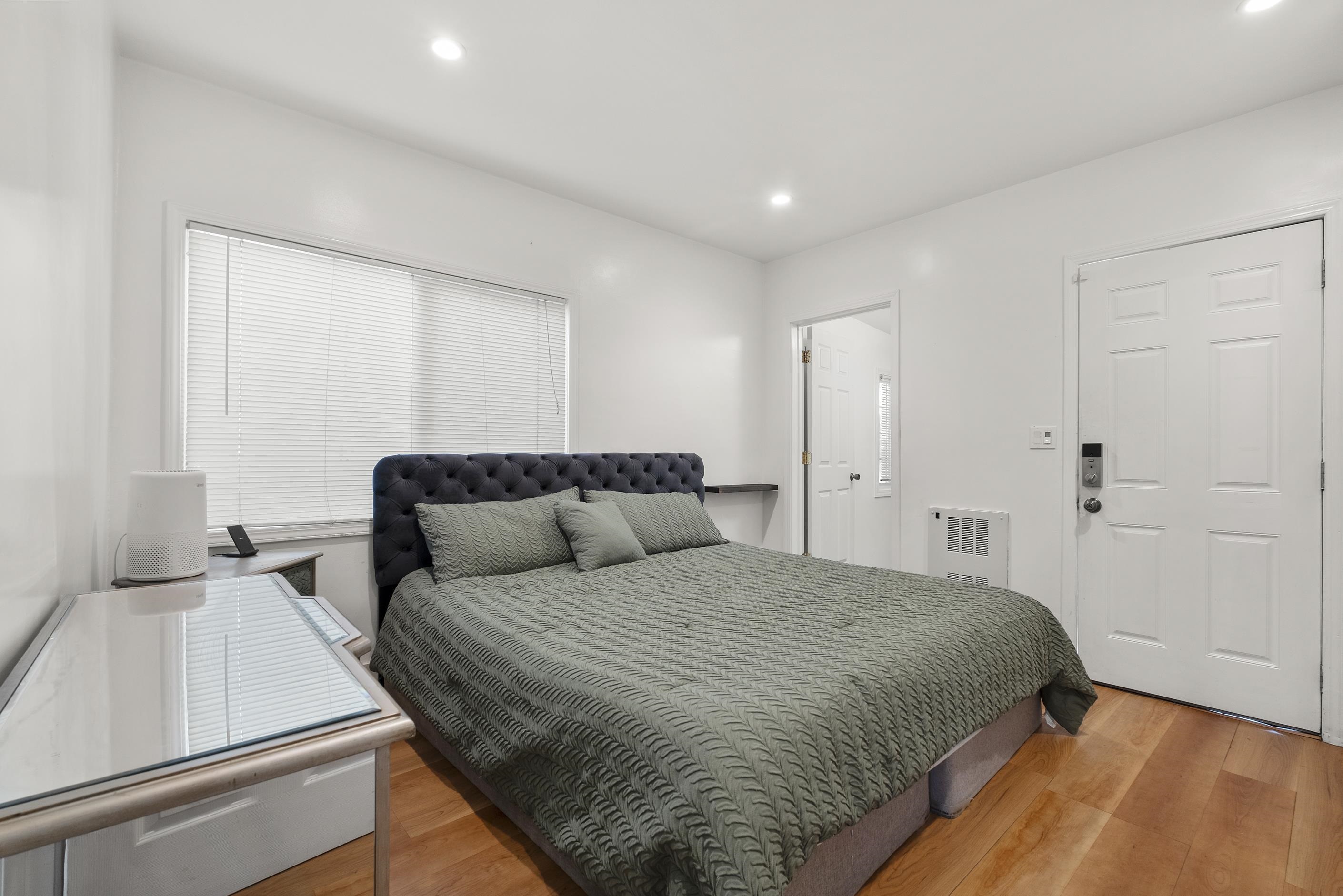 1039 Channing Way Berkeley, CA 94710 - Photo 23 of 25 Bedroom with light wood-style flooring and recessed lighting