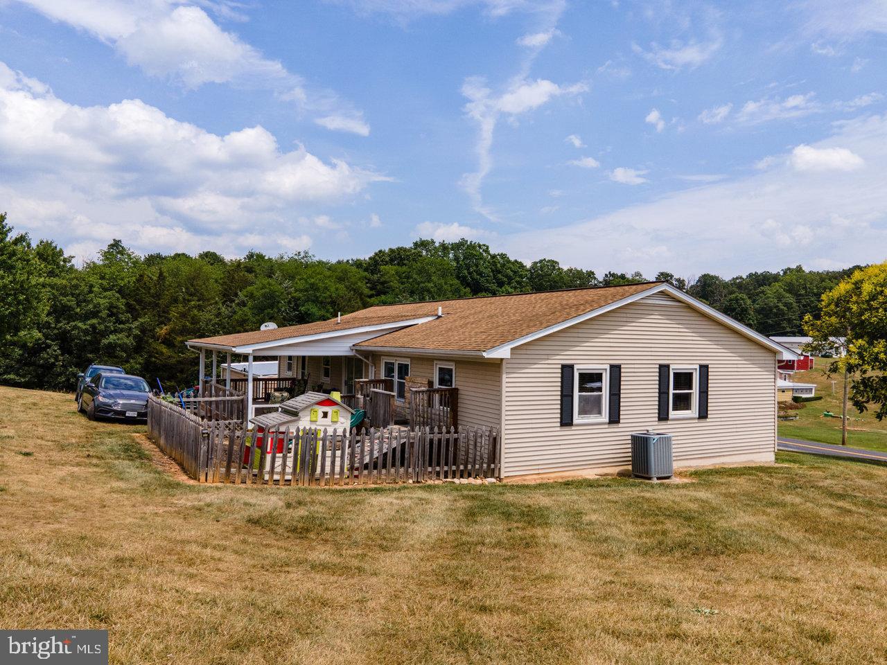1789 Back Road Woodstock, VA 22664 - Photo 8 of 50 Back yard has a fenced play area.