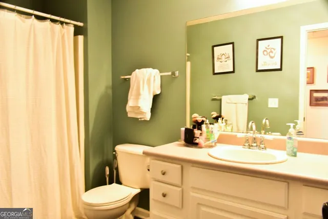 an empty room with a ceiling fan and a window