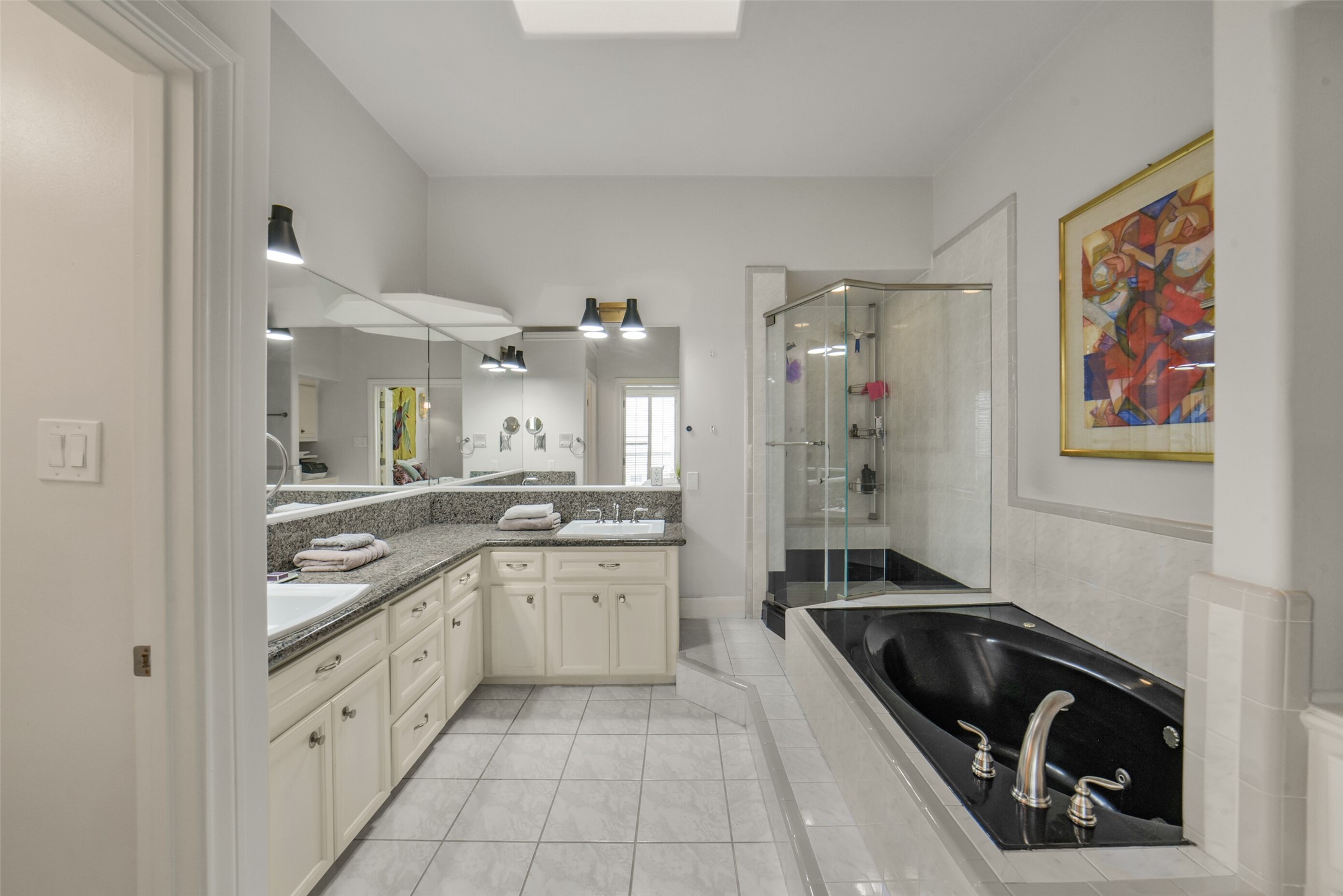 2026 Welch Street Houston, TX 77019 - Photo 20 of 28 primary bathroom has walk in shower and separate tub