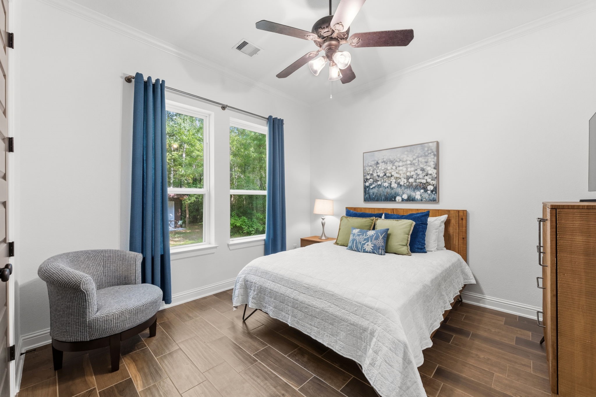248 Fire Sky Road Huntsville, TX 77340 - Photo 22 of 36 Lovely secondary bedroom on the first floor with abundant natural light and peaceful views of the wooded property.