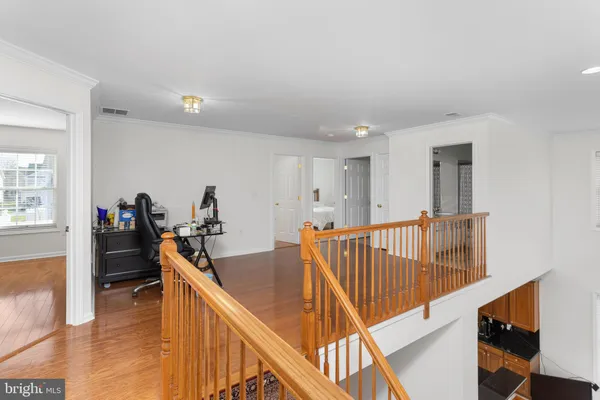 a view of a hallway with seating area